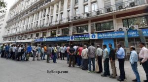 People queue up at ATM
